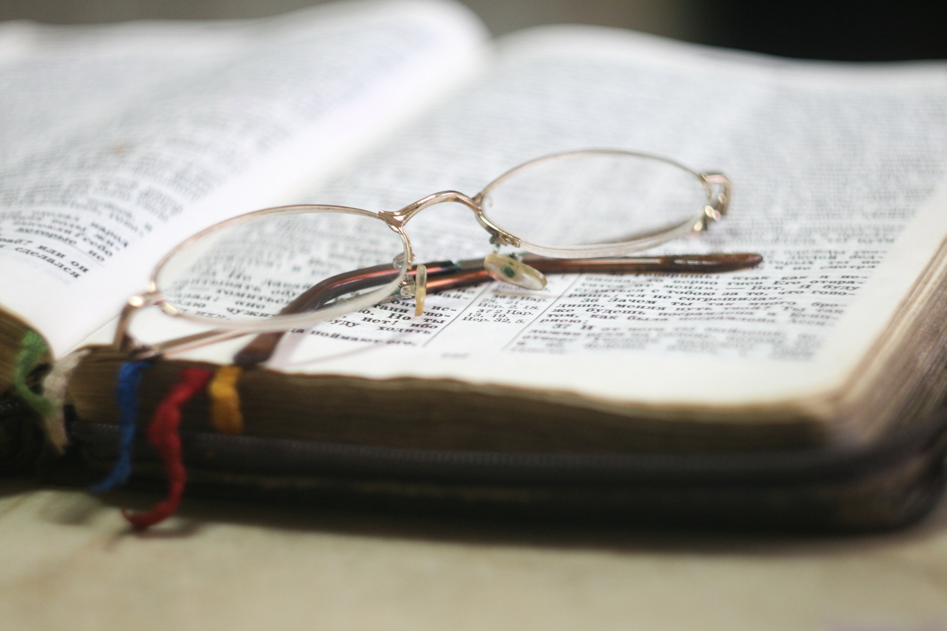Open Bible with a pair of glasses on top